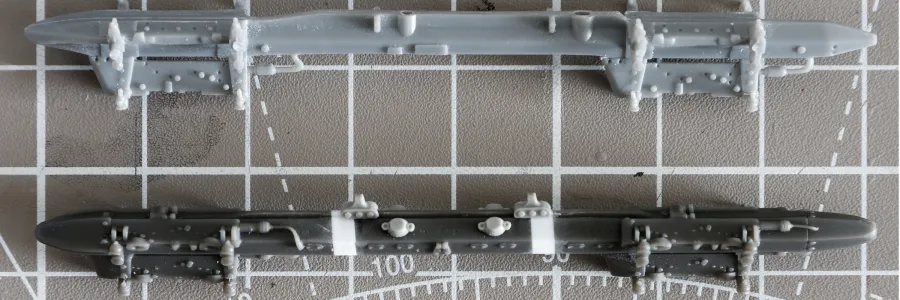 Eduard's Multiple Ejector Rack with lengthening shims alongside a Hobby Boss kit part