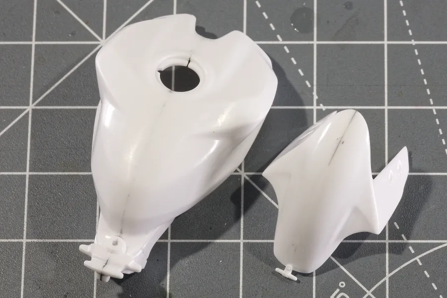 Scale model motorbike bodywork joined with rubberised CA glue, before painting